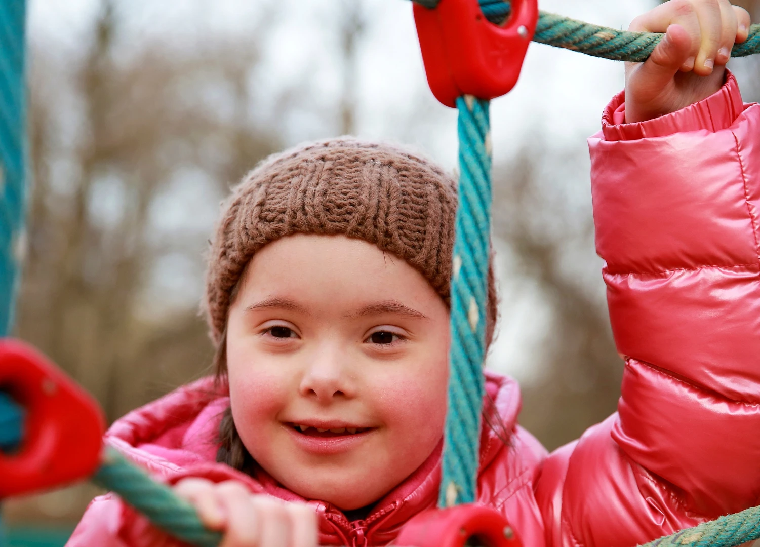 Child playing on climbing ropes